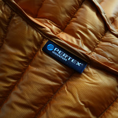 close up detail photo of the Pertex woven label as the HIMALI accelerator down jacket is made with flourocarbon free Pertex Quantum 20 Denier fabric