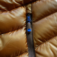 a detail photo of the YKK zipper used on the HIMALI accelerator down jacket
