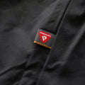 A detail photo for the mens ascent hoodie hilighting the primaloft woven label
