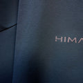 A fit photo of the HIMALI Mens Guide Flex Pant hilighting the 4way stretch fabric & reflective HIMALI logo