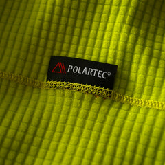 A close up photo showing the 100% recylced polartec Powergrid fleece material of the HIMALI Limitless Grid Fleece Hoodie in the colorway ANTIfreeze