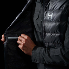 Close up view of the interior YKK zipper electronics pocket on the Men's Focus Down Vest in Deep Space