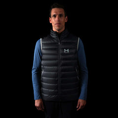 fit photo of the Men's Focus Down Vest in colorway Deep Space with 700 fill power hyperdry RDS certified down with a mindful blue pursuit longsleeve underneath