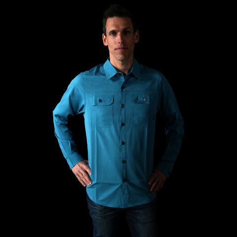 A frontal fit photo of the HIMALI mens jetsetter ultra-vent button down shirt in the colorway ELECTRIC TEAL on a male model