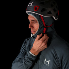 A close up fit photo of the HIMALI Limitless Grid Fleece Hoodie in the colorway EVENING MIST. Showing the male model wearing the hoodie underneath a climbing helmet