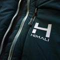 a closeup photo of the womens ascent stretch hoodie featuring the ykk zipper and custom himali zipper pulls