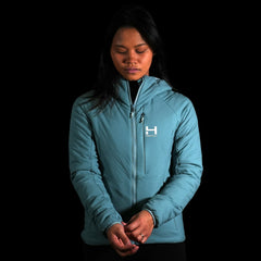 a fit photo of a person wearing the womens ascent stretch hoodie with 100g primaloft gold insulation