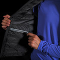 close up view of the interior YKK zipper electronics pocket on the Women's Focus Down Vest in Deep Space with a lupine pursuit longsleeve underneath