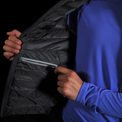 close up view of the interior YKK zipper electronics pocket on the Women's Focus Down Vest in Deep Space with a lupine pursuit longsleeve underneath