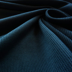 A closeup detailed view of the quick drying and moisture wicking Polartec fabric of the Women's Momentum Hoodie