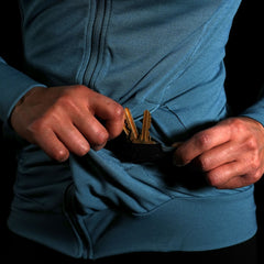 A closeup photo showcasing the interior of the left front pocket on the Women's Polartex Momentum Hoodie, with the integrated key loop and key pocket