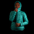 A fit photo of a person wearing the hooded peak 7 down jacket using the front center YKK zipper