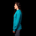 a fit photo of the side of the womens Eclipse Sun Hoodie with UV protection in colorway Electric Mint
