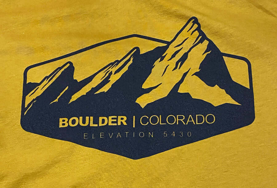 a close up print of the boulder flatirons on a cotton shirt
