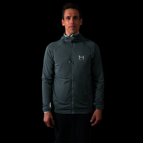 A frontal fit photo of the HIMALI Limitless Grid Fleece Hoodie in the colorway EVENING MIST on a male model